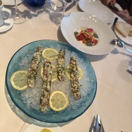 Marea signature dishes Astice (Lobster with burrata and eggplant)Fusilli with Red Wine Braised Octopus and Bone MarrowSalt-Baked Sea Bass
